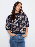 Floral patterned top with a mock neck, offering a chic and modern touch for any casual outing by Charlie B.