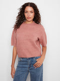 This knit top features a stylish mock neck, adding elegance to any outfit. Perfect for layering or wearing alone by Charlie B.