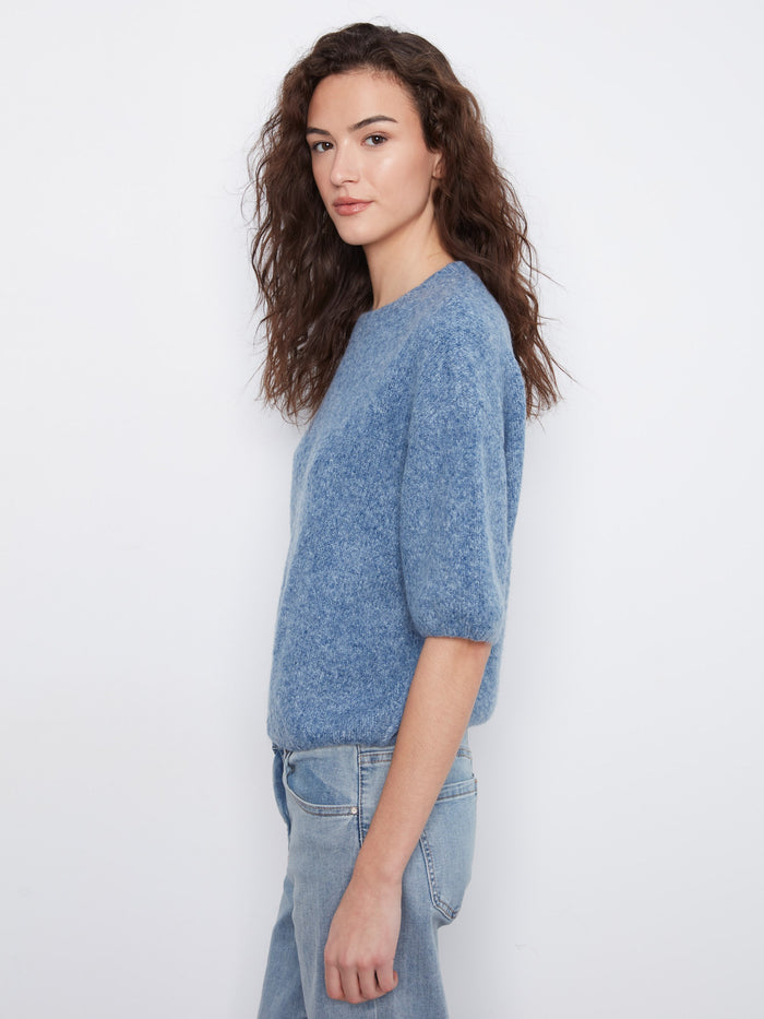Blue knit top showcasing a comfortable relaxed fit and stylish design by Charlie B.