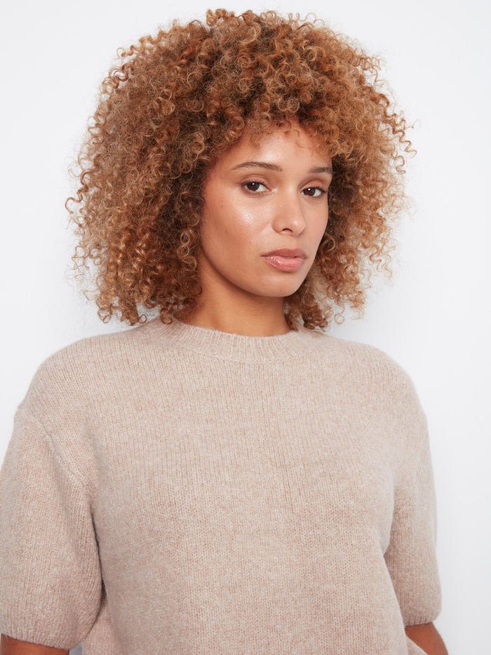The balloon elbow sleeves add a unique flair, making it perfect for casual or formal occasions. By Charlie B.