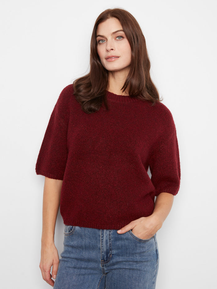 This sweater features a mock neck design, adding sophistication to your casual look. By Charlie B.