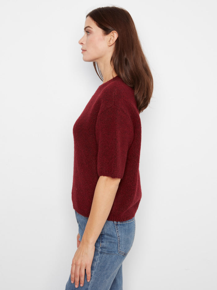 A stylish mock neck complements the cozy texture of this elegant knit sweater. By Charlie B.