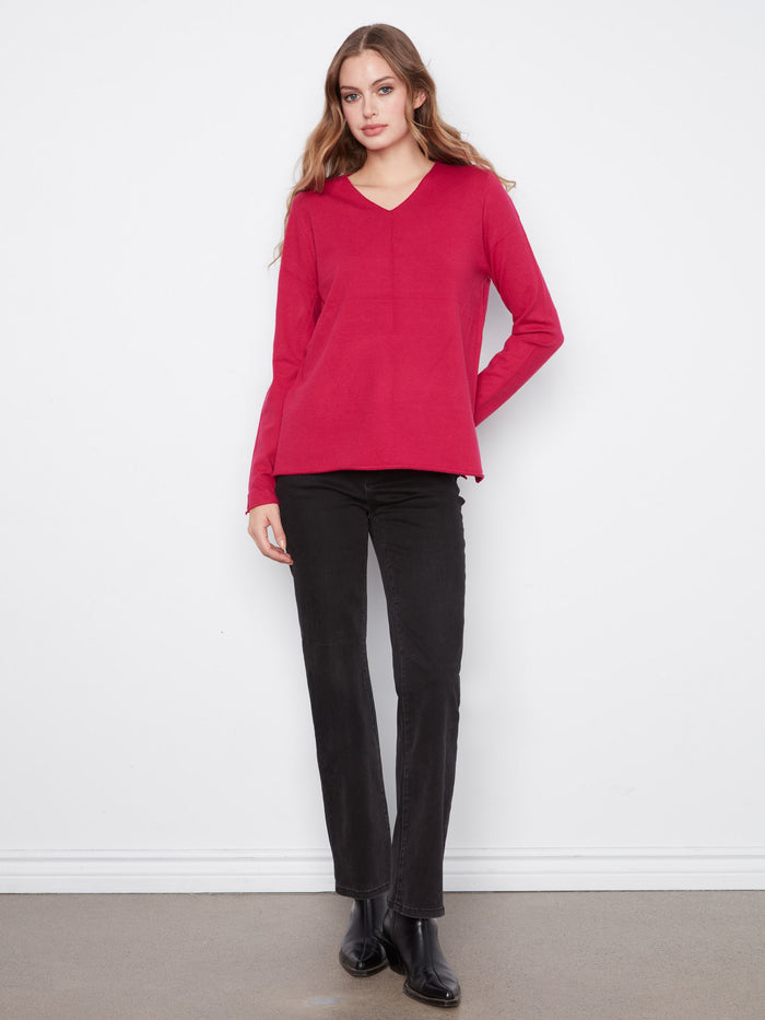Long sleeves provide a cozy feel in this stylish knit garment. By Charlie B.
