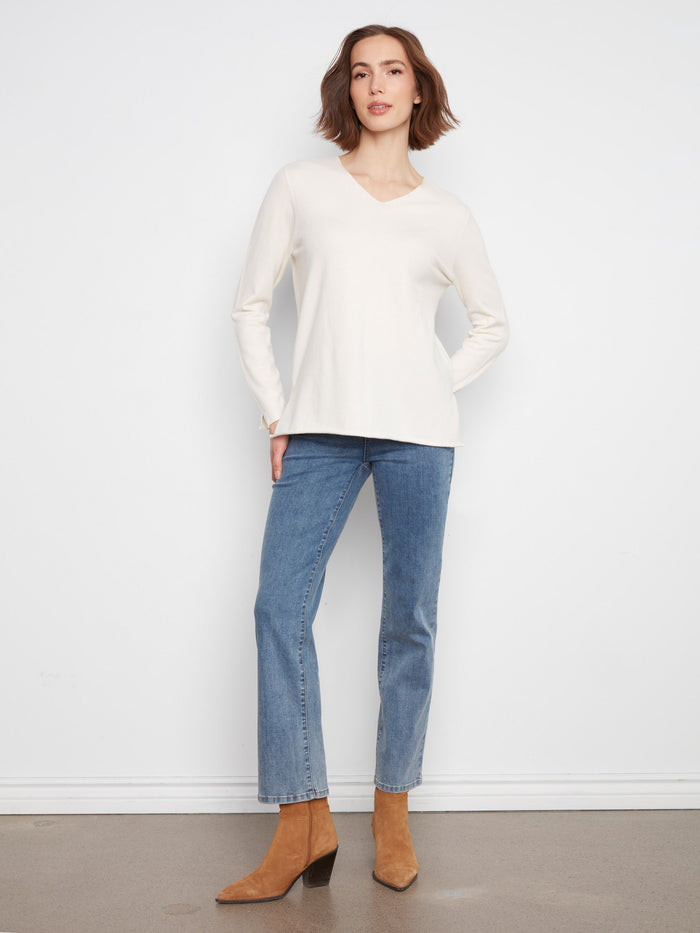 This stylish top features long sleeves, offering warmth and sophistication. Ideal for cooler days by Charlie B.