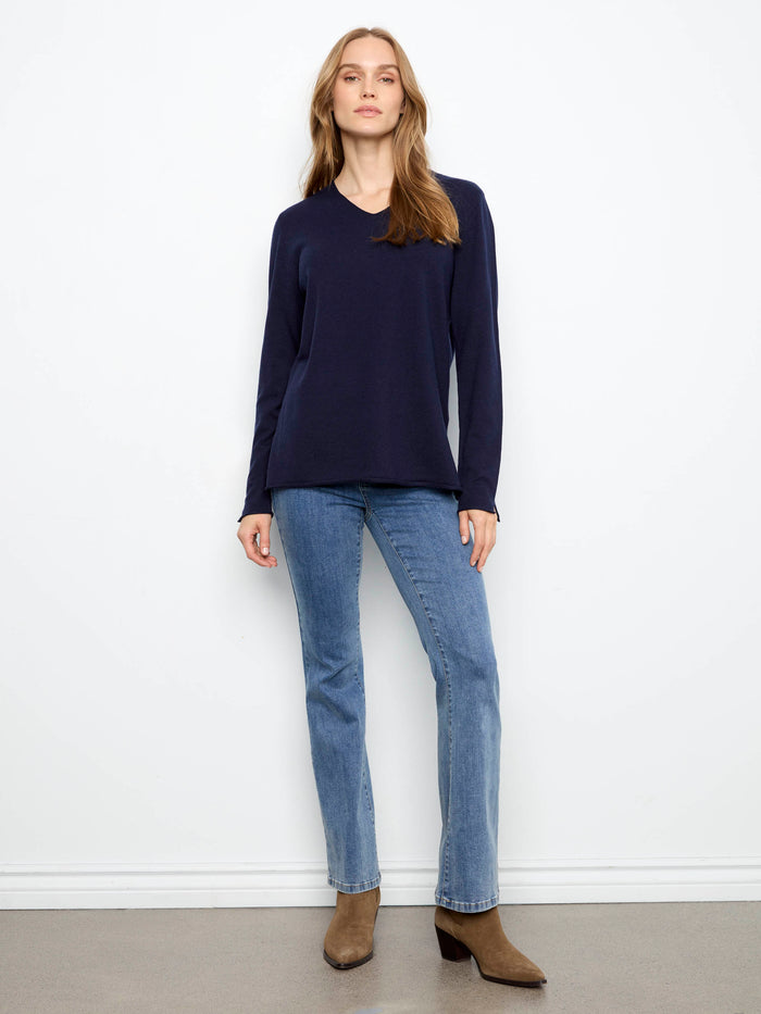Crafted from a soft knit material, this piece delivers coziness without compromising on elegance. By Charlie B.