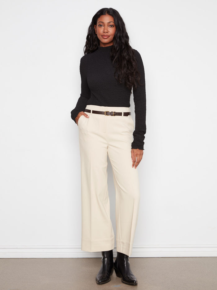 These pants feature a chic wide leg design, offering both style and comfort for any occasion. By Charlie B.