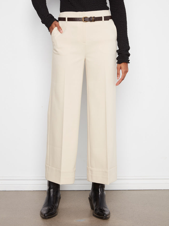 The cropped length of these trousers adds a modern touch to your wardrobe essentials. By Charlie B.