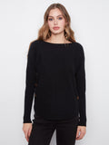 Black sweater with a boat neck and rounded hem, featuring elegant side button details by Charlie B.