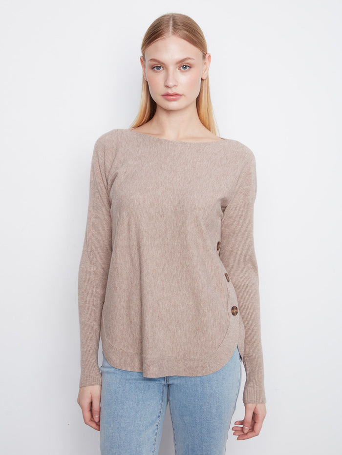 Sweater with a stylish boat neck, offering a chic and modern look. Perfect for any casual outing. By Charlie B.