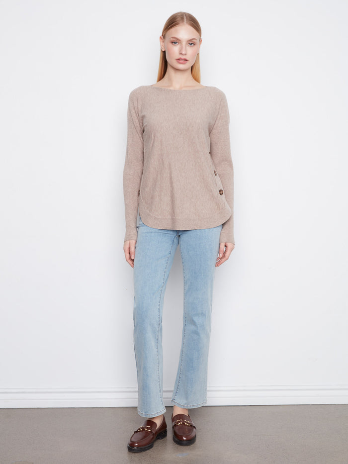 Soft sweater designed with a rounded hem, creating a flattering silhouette for all occasions. By Charlie B.