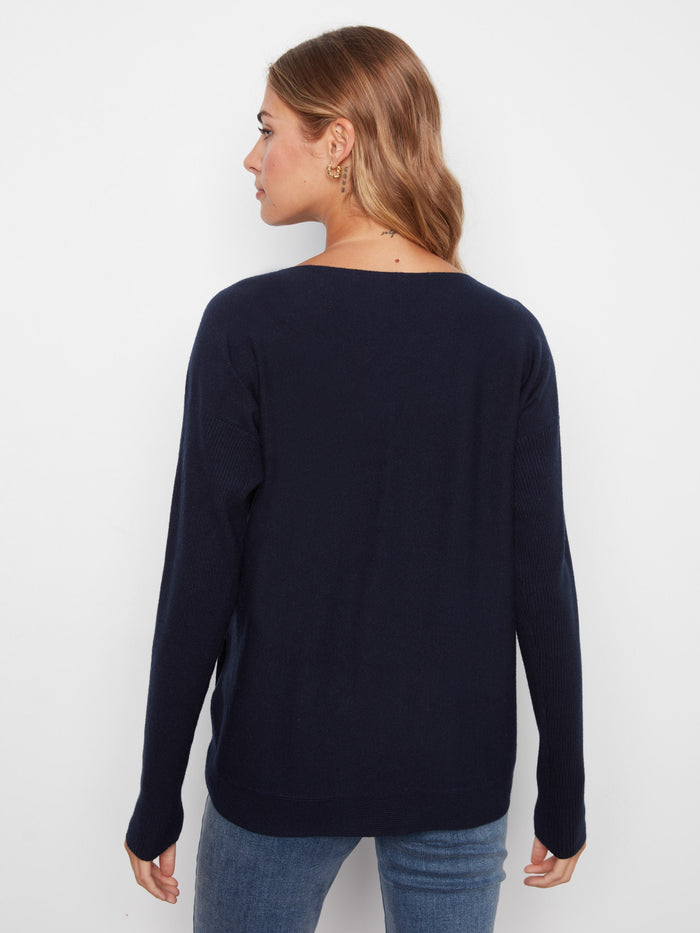 Classic navy sweater with ribbed sleeves, offering both comfort and style in one garment by Charlie B.