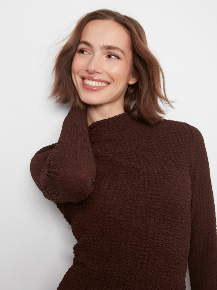 Lettuce-edge trim detail brings charm and femininity to this versatile piece by Charlie B.