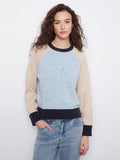 The sweater features a cozy crew neck design with a speckled knit pattern, perfect for casual outings. By Charlie B.