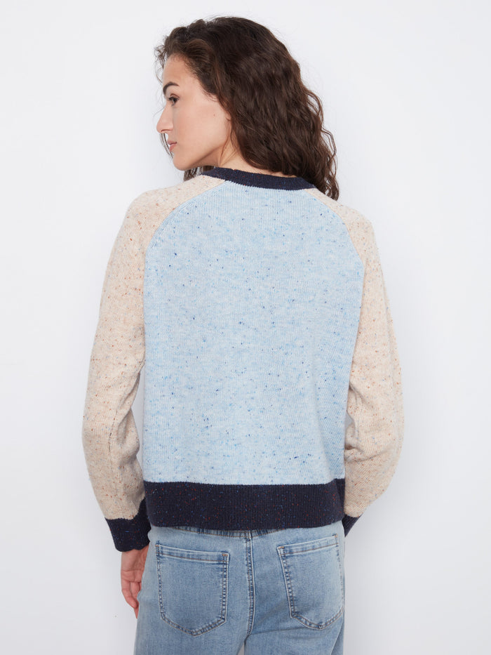 Ideal for layering, the long raglan sleeves ensure ease of movement and warmth throughout the day. By Charlie B.