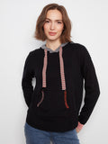 Black sweater with a kangaroo pocket and vibrant contrast stitching on the pocket edges by Charlie B.