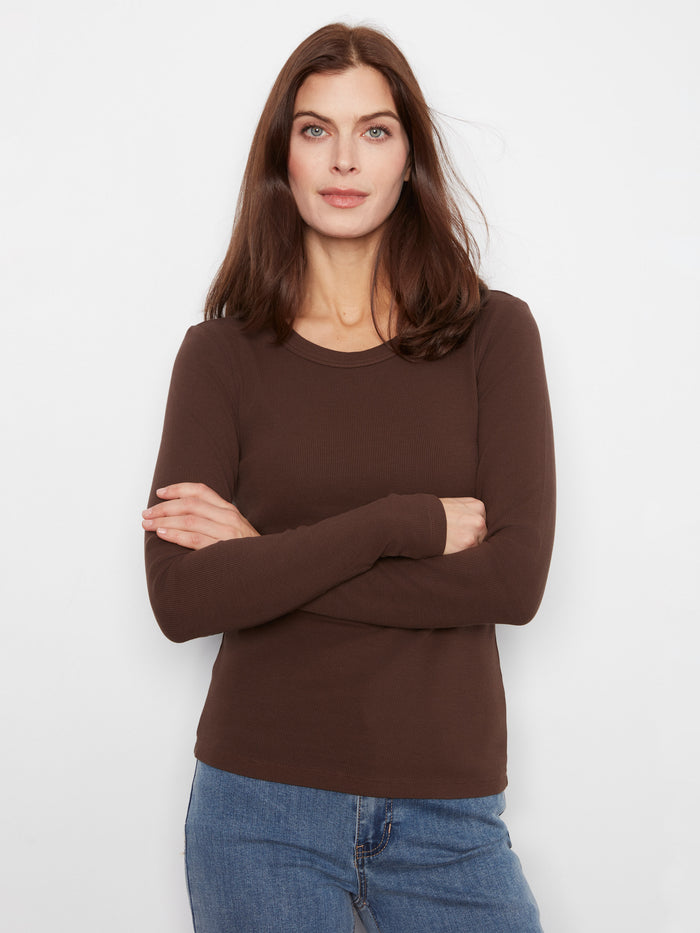 The slim fit design of this brown top provides a sleek and modern silhouette by Charlie B.