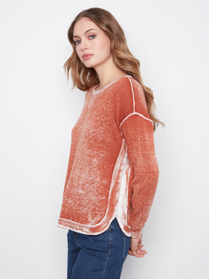 This sweater boasts drop shoulders and a stylish washed finish, perfect for effortless style by Charlie B.