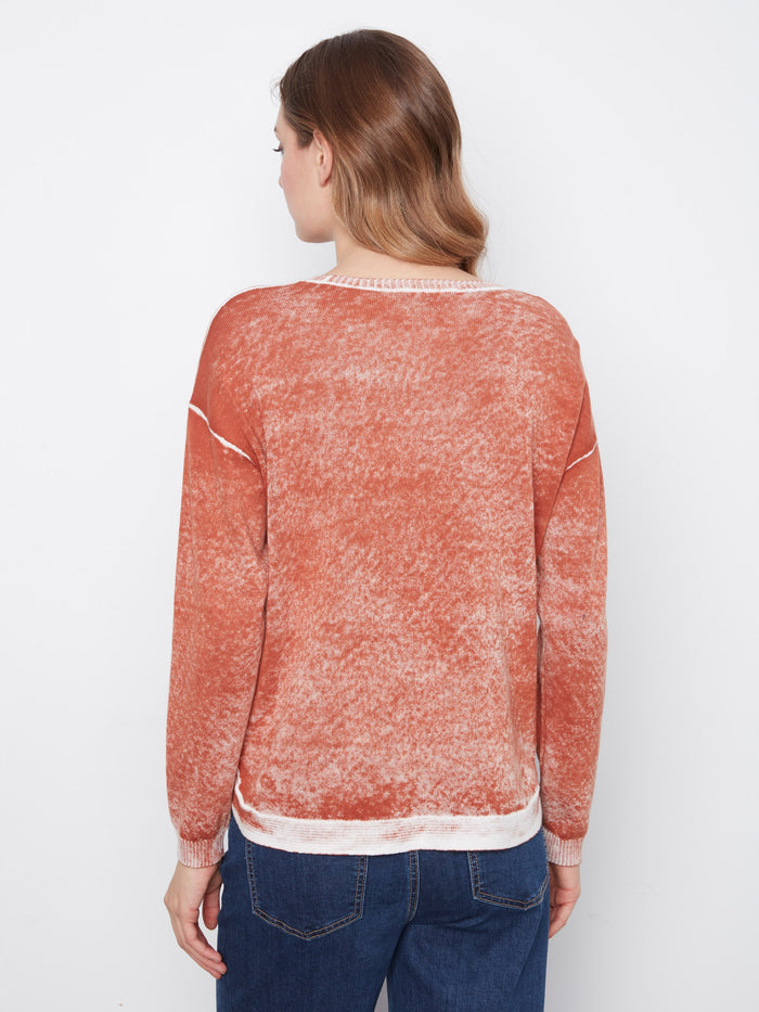 Crafted from 100% cotton, this sweater features a unique washed finish for added texture by Charlie B.