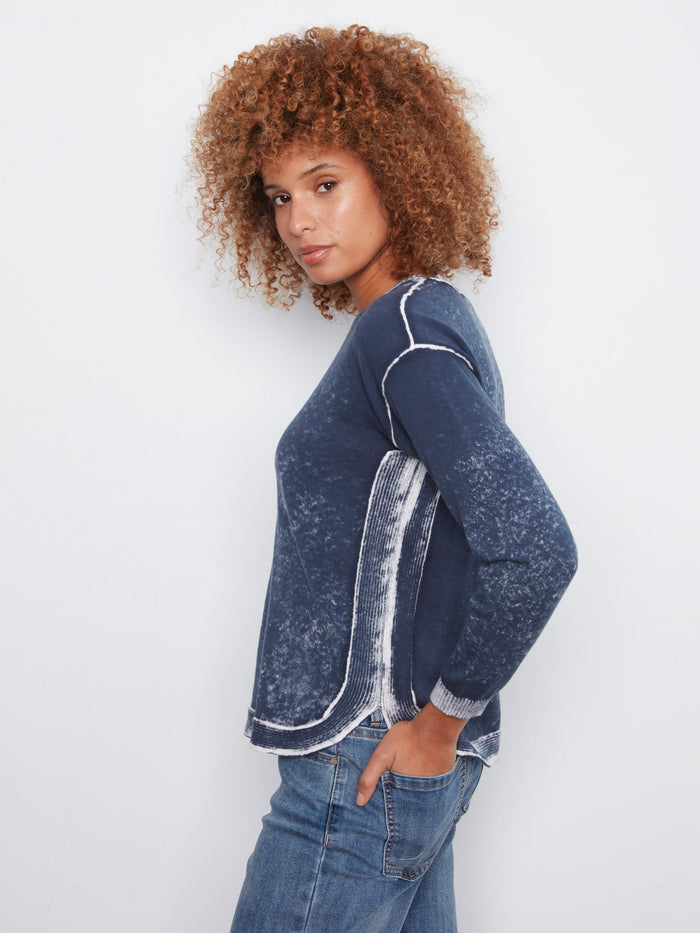 Rounded hem adds a modern touch to this classic crew neck sweater crafted from 100% cotton by Charlie B.