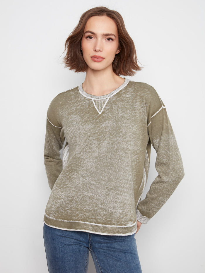 Olive sweater featuring a crew neckline, perfect for casual outings. Made from 100% cotton with a washed finish by Charlie B.