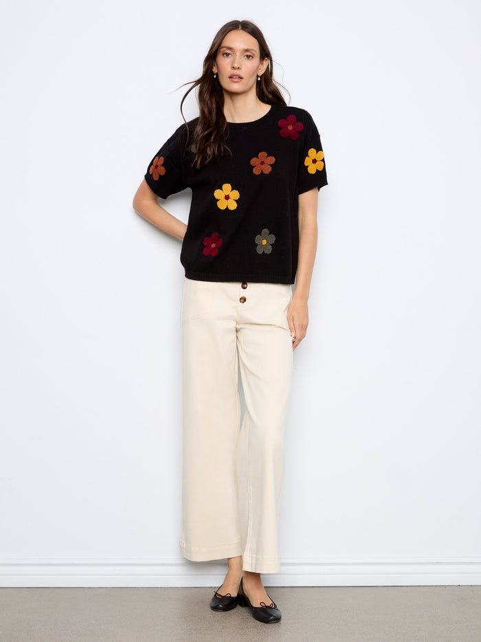 Floral embroidered black sweater featuring elbow sleeves, offering a stylish touch to your wardrobe by Charlie B.