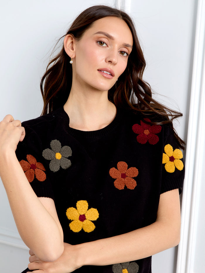 Chic black sweater with colorful floral patterns, made of 100% cotton for a soft feel by Charlie B.