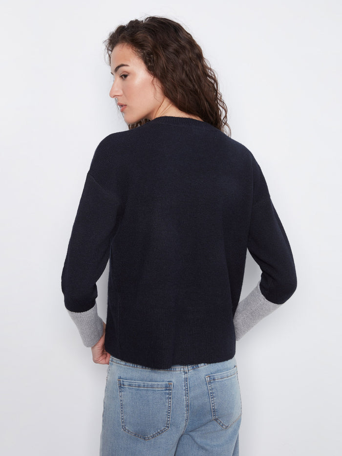 Navy crew neck top featuring elegant long sleeves and subtle contrast designs by Charlie B.