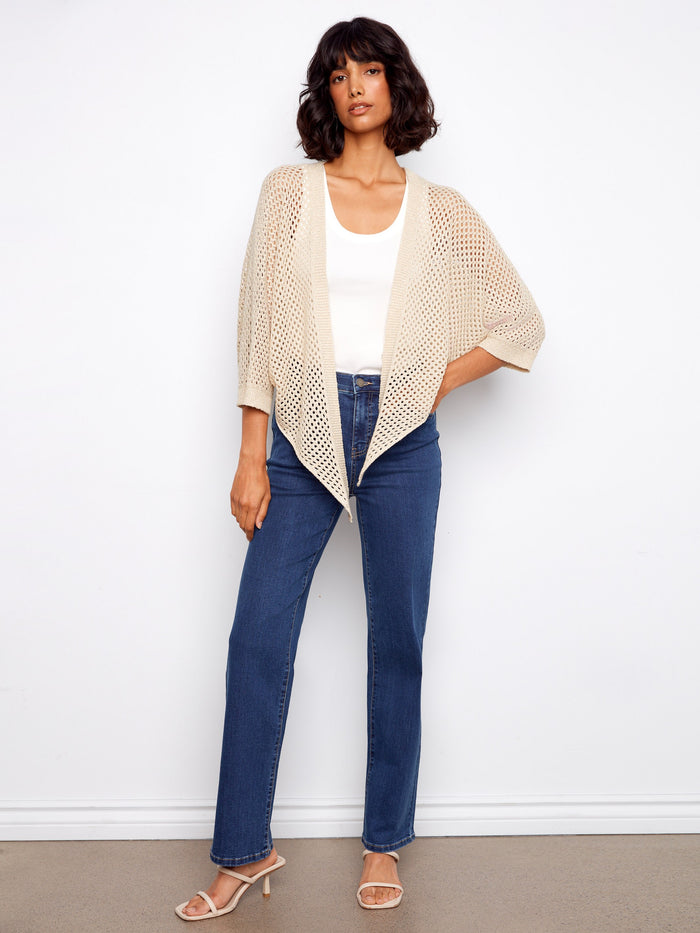 Elegant beige fishnet sweater with adjustable tie-front design, ideal for versatile styling by Charlie B.