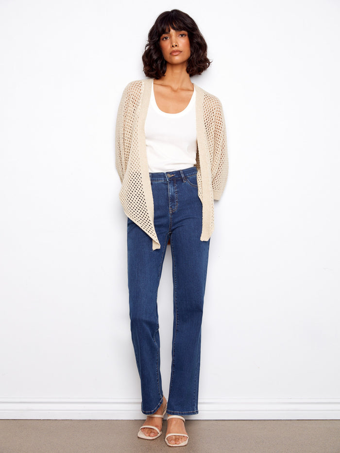 Chic crochet shrug showcasing elbow dolman sleeves and a hint of shimmer in the fabric by Charlie B.