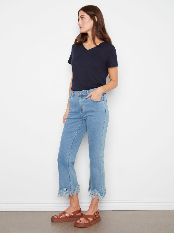 Showcasing fringed hem detail, these jeans add a playful touch to your wardrobe essentials. Crafted thoughtfully by Charlie B.