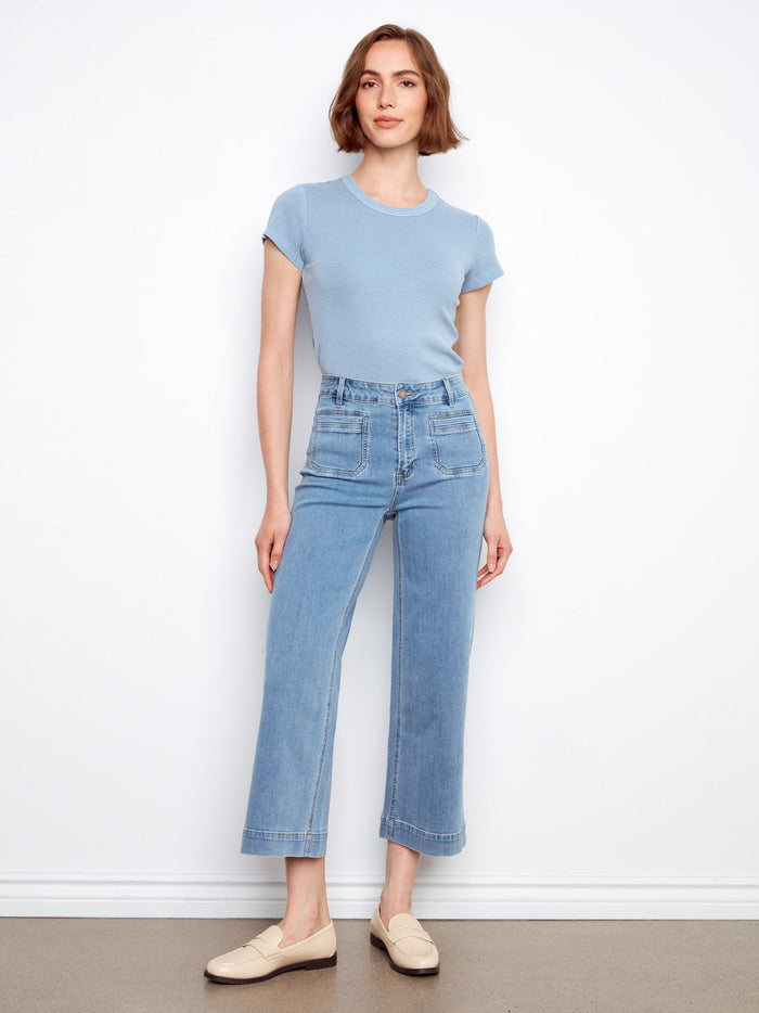 These jeans feature a stylish flare fit, adding a touch of modern elegance to any outfit. Crafted with care by Charlie B.
