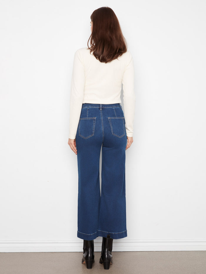 Classic patch pockets add functionality and flair to these versatile denim pants, perfect for any casual occasion by Charlie B.