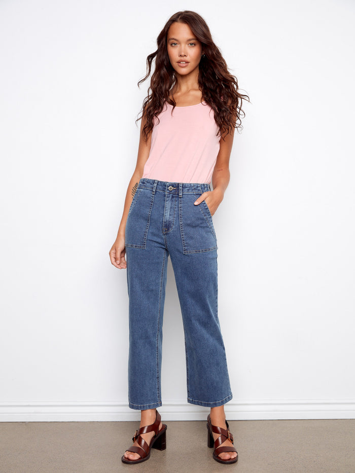 Denim pants with a straight fit, featuring utility style pockets for practical elegance. Designed with stretch fabric by Charlie B.