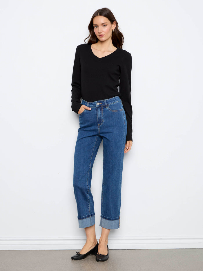 Crafted from stretch denim, these jeans offer a comfortable fit with stylish cuffed hems and leopard print accents by Charlie B.