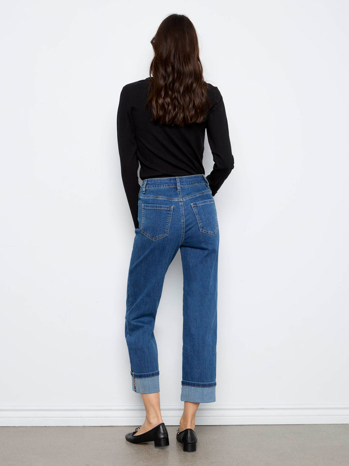 The cuffed hem with leopard print trim adds an edgy touch to these chic blue denim jeans by Charlie B.