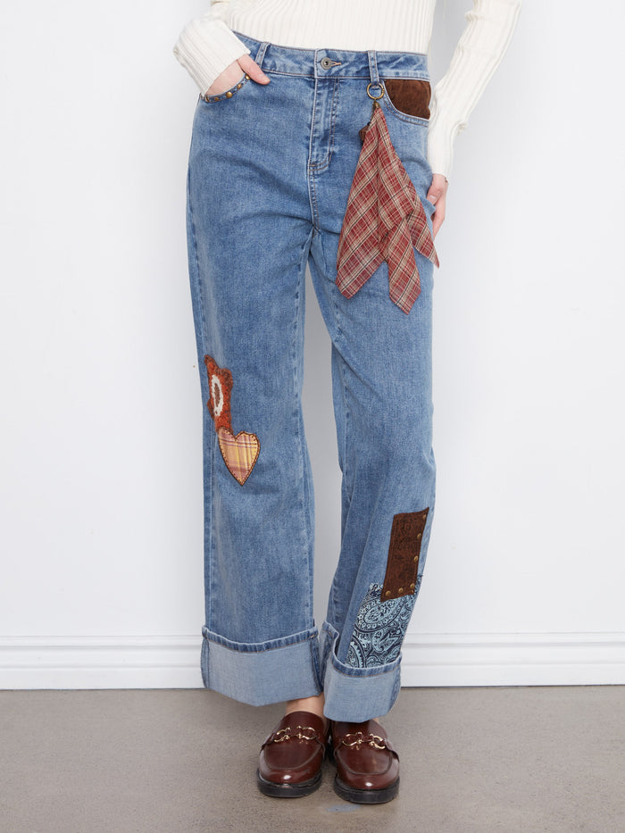 Crafted in stretch denim, these ankle-length jeans offer both comfort and style. Adorned with decorative elements by Charlie B.