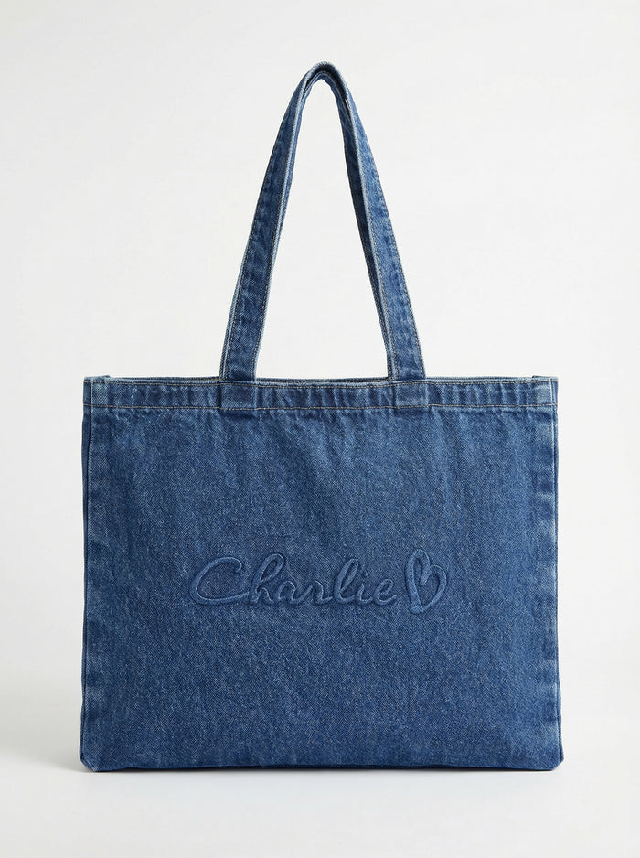 Stylish denim bag with carry handles and embossed Charlie B logo, perfect for daily use. By Charlie B.
