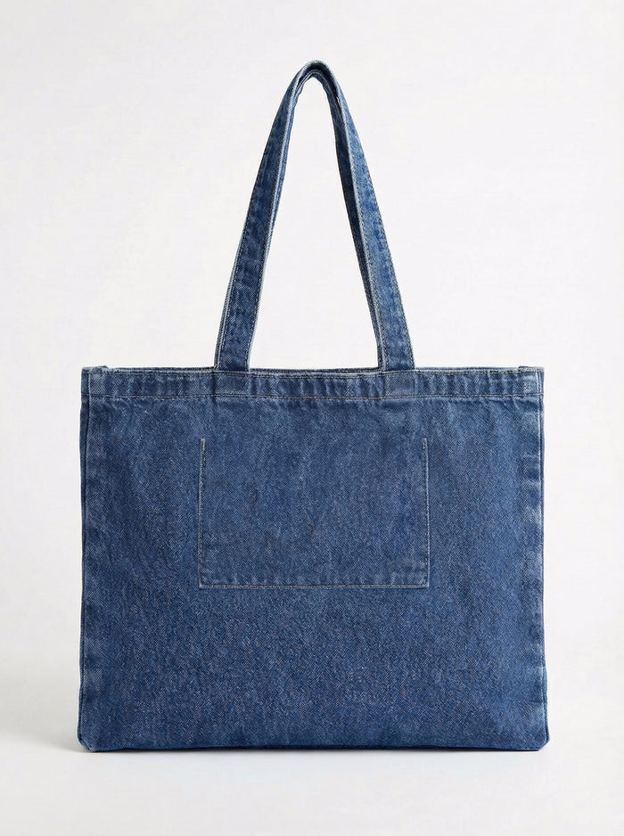 Functional and fashionable denim bag with a handle height of 10" for easy carrying. Made by Charlie B.