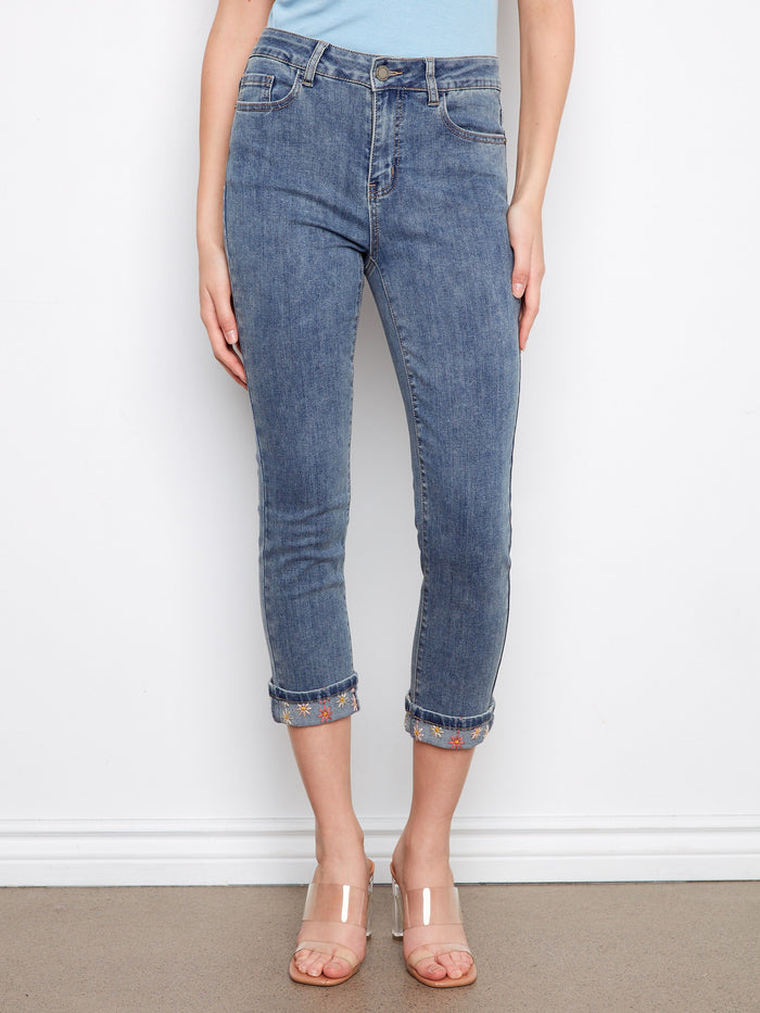 Cropped slim-leg jeans in medium blue with stretch denim and intricate embroidery on the cuffs, perfect for any occasion by Charlie B.