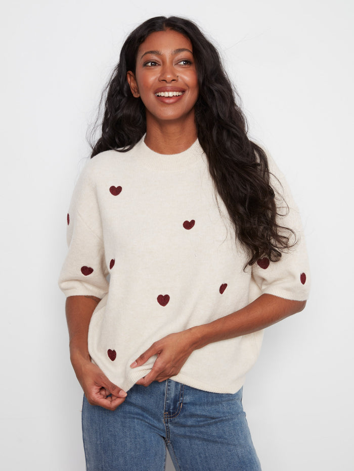 Elegant balloon elbow sleeves and relaxed fit make this sweater a versatile choice for any occasion. By Charlie B.