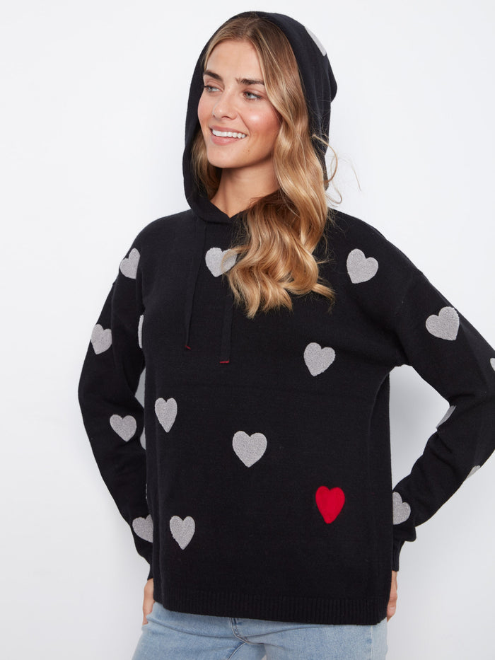 Charming black hoodie showcasing embroidered hearts, designed with a comfortable hood and drawstring detail. Effortlessly chic by Charlie B.