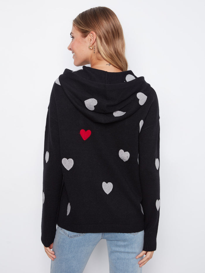 Elegant black hoodie highlighted by its soft knit fabric and playful heart embroidery. A must-have piece for comfort lovers by Charlie B.