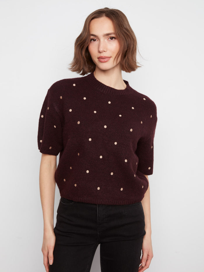 Heather-wine sweater with a relaxed fit and polka dot embroidery, perfect for cozy days. Styled by Charlie B.