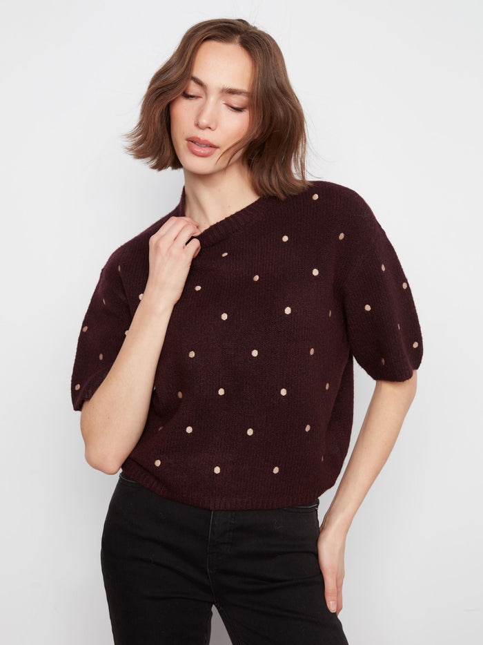Experience the comfort of soft brushed knit in this heather-wine sweater adorned with polka dots by Charlie B.