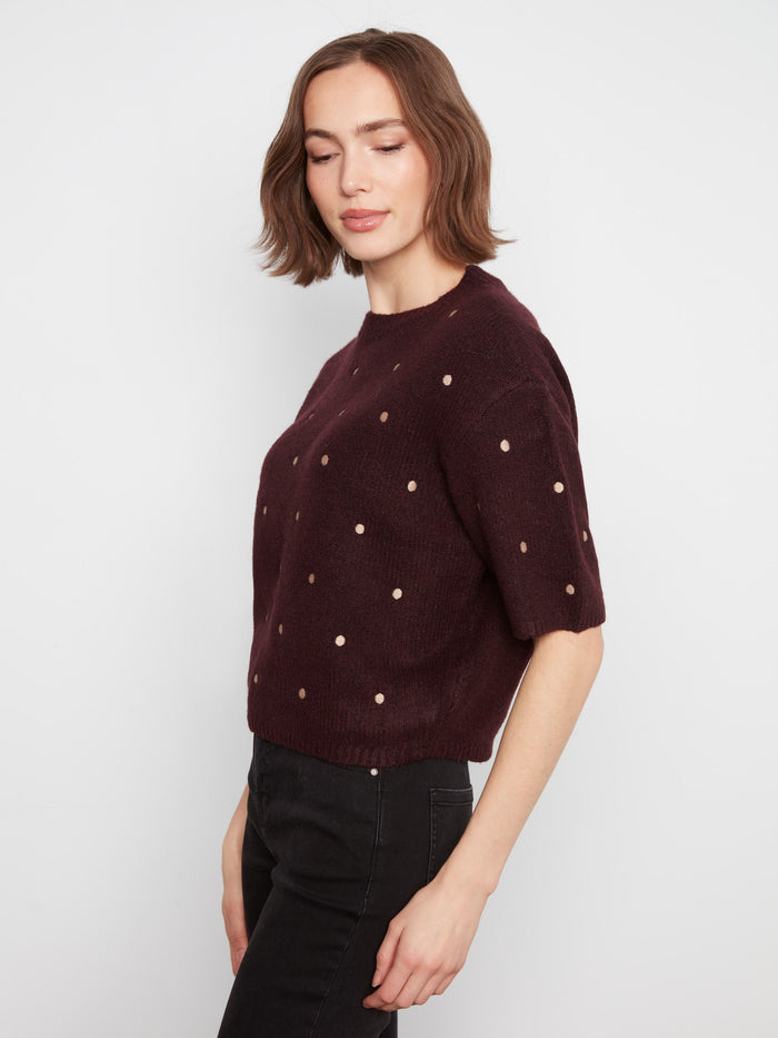 Balloon elbow sleeves add a playful touch to this elegant heather-wine sweater with polka dots. Crafted by Charlie B.