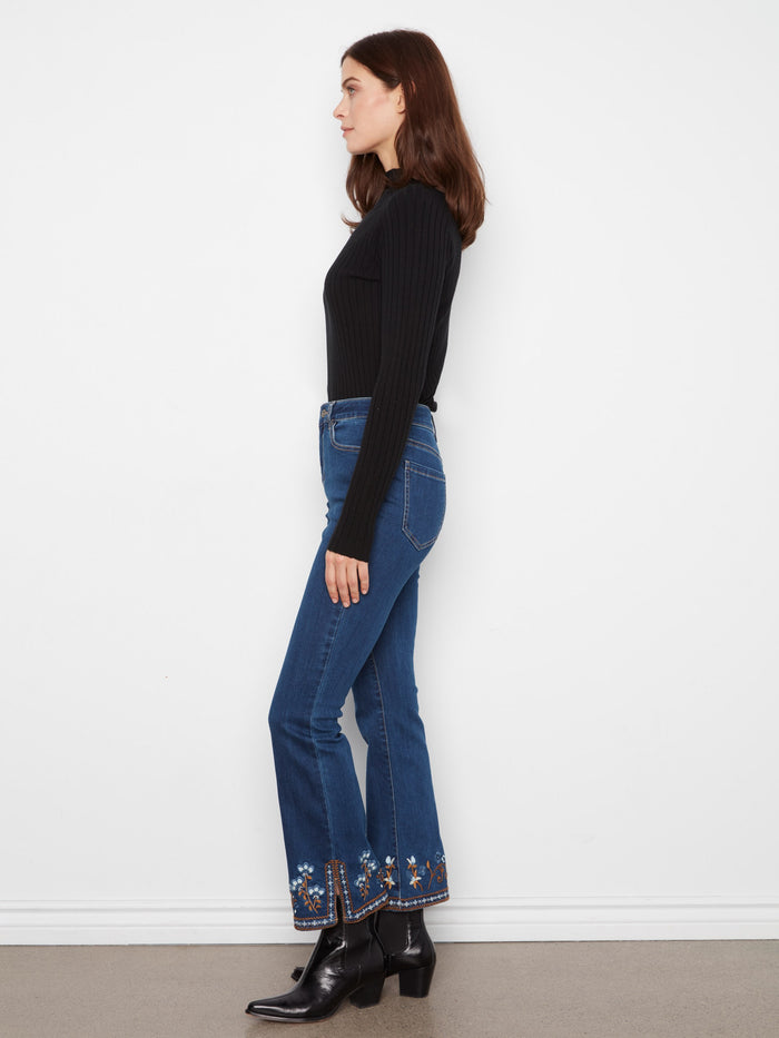 Embroidered hem detailing adds a unique touch to these chic denim jeans. By Charlie B.