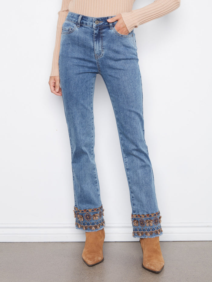 These full-length jeans offer style and comfort, featuring an embroidered fringe hem for a unique look by Charlie B.