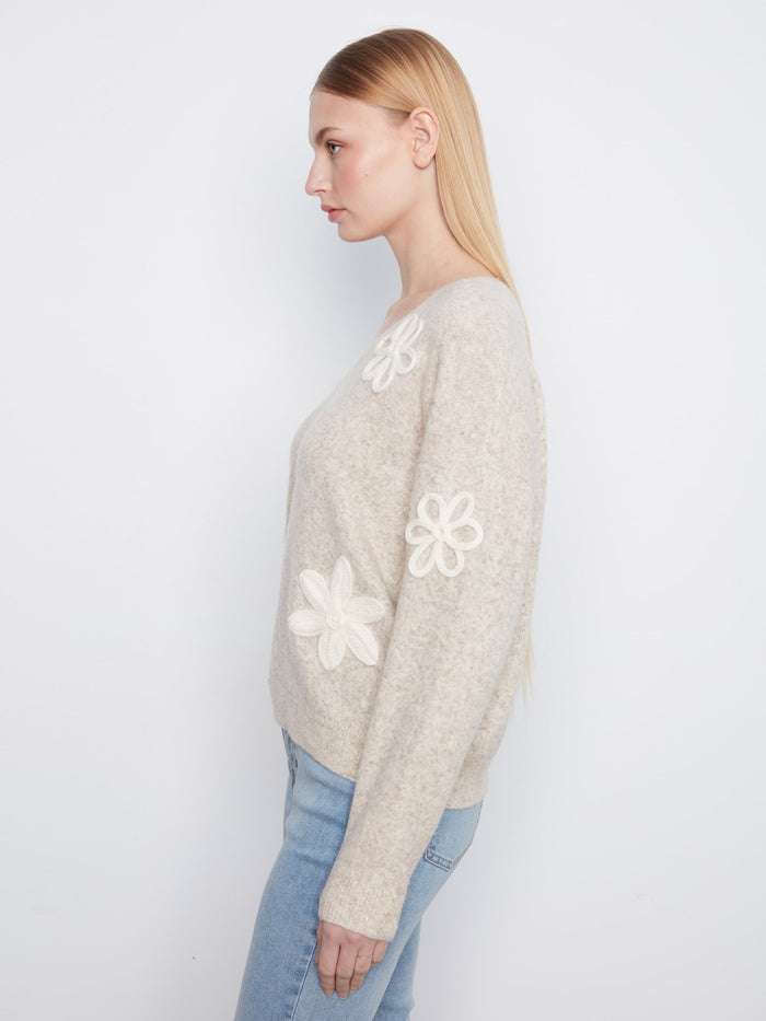 Soft V-neck sweater in almond hue with unique floral appliqué accents on the sleeves by Charlie B.