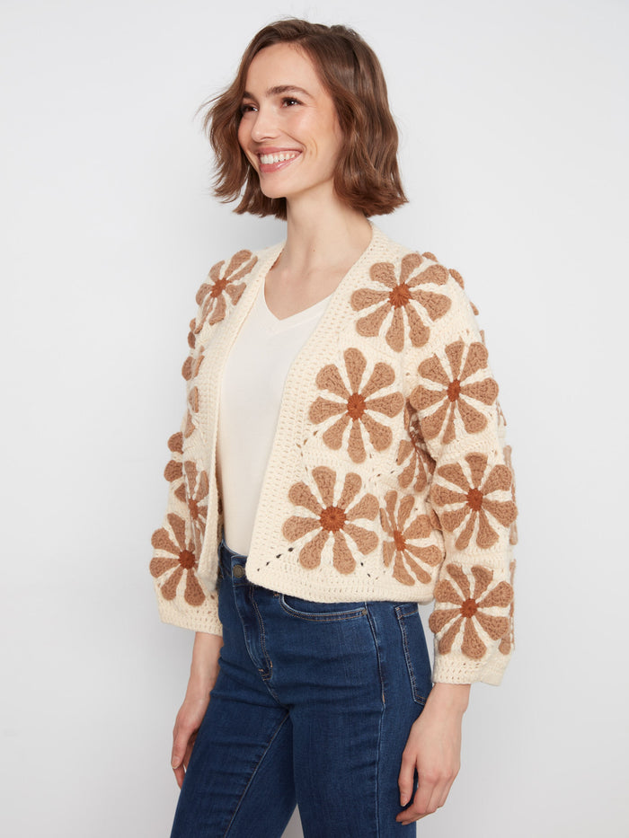 Relaxed fit ecru cardigan with intricate crochet flowers, offering a chic open-front design by Charlie B.