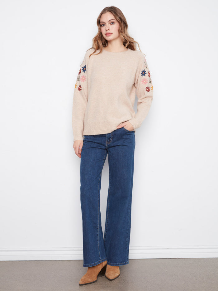 Adorned with ribbed cuffs and hem, this sweater combines comfort and style effortlessly, making it a versatile wardrobe staple by Charlie B.